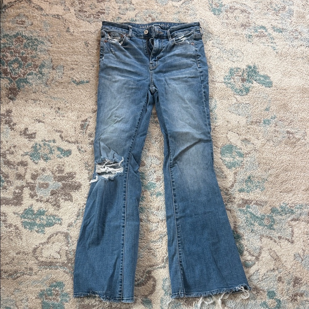 American Eagle Outfitters medium blue distressed flare jeans